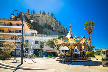 Town of Cassis carousel and hill fortress view