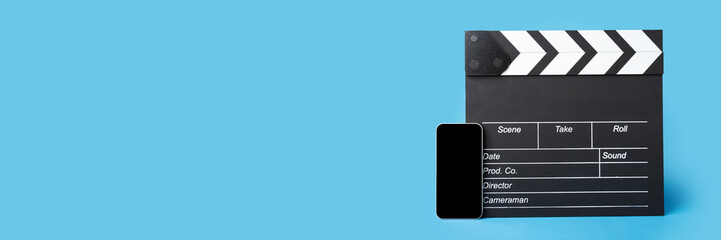 Obraz premium Cinema tickets online, clapper board and phone, browsing movie selections on the internet while waiting in line, booking platform, mobile application, banner