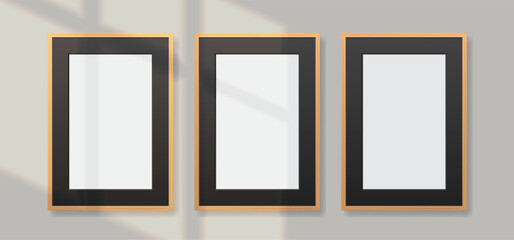 Set of blank realistic vertical wood photo frames with black passepartout on wall. Vector template illustration