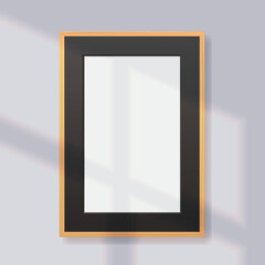Blank vertical wood photo frame with black passepartout on gray wall. Vector realistic template illustration