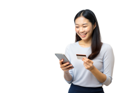 A smiling woman uses a smartphone while holding a credit card, making an online purchase