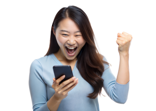 Young woman in blue sweater celebrating success with a raised fist while looking at her phone