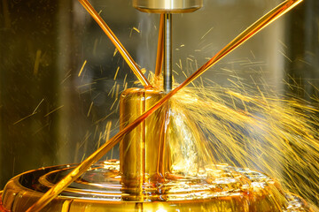 The CNC milling machine cutting the shell mold parts with oil coolant method . © Pixel_B