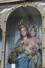 Obraz premium Virgin Mary with baby Jesus, main altar in the Church of the Helper of Christians in Orebic, Croatia