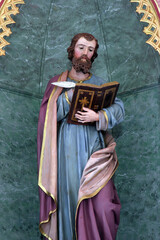 Fototapeta premium Saint Luke the Evangelist, statue on the High altar in the parish church of Saint Luke in Lukac, Croatia