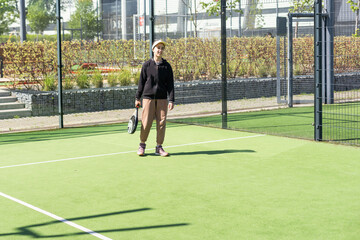 Young girls playing padel on a sunny day