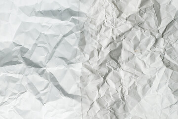 Crumpled white paper background.