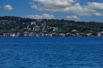 Fototapeta premium Turquoise blue sea water. View of the Bosphorus in Istanbul city on sunny summer day, in a public place.