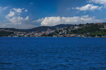 Fototapeta premium Turquoise blue sea water. View of the Bosphorus in Istanbul city on sunny summer day, in a public place.