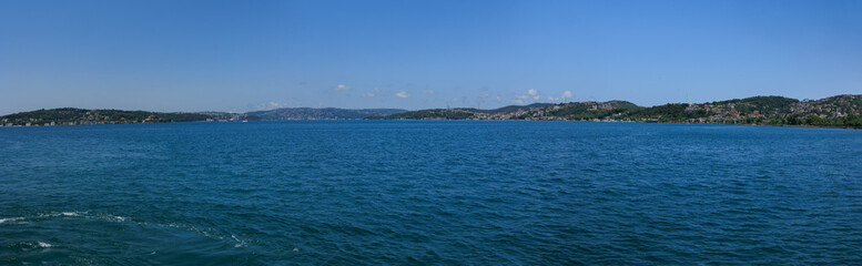 Turquoise blue sea water. View of the Bosphorus in Istanbul city on sunny summer day, in a public place.