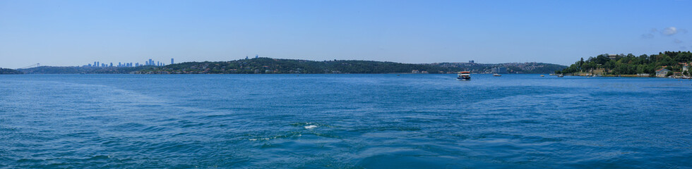 Turquoise blue sea water. View of the Bosphorus in Istanbul city on sunny summer day, in a public place.