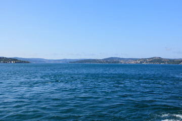 Turquoise blue sea water. View of the Bosphorus in Istanbul city on sunny summer day, in a public place.