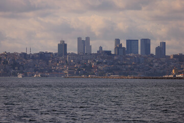 Fototapeta premium Turquoise blue sea water. View of the Bosphorus in Istanbul city on sunny summer day, in a public place.