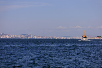 Turquoise blue sea water. View of the Bosphorus in Istanbul city on sunny summer day, in a public place.