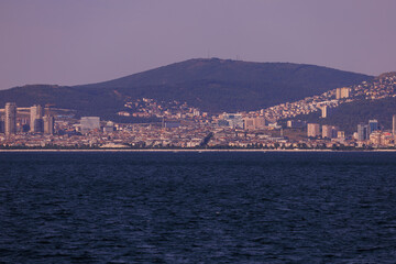 Fototapeta premium Turquoise blue sea water. View of the Bosphorus in Istanbul city on sunny summer day, in a public place.