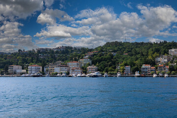 Fototapeta premium Turquoise blue sea water. View of the Bosphorus in Istanbul city on sunny summer day, in a public place.