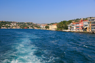 Fototapeta premium Turquoise blue sea water. View of the Bosphorus in Istanbul city on sunny summer day, in a public place.