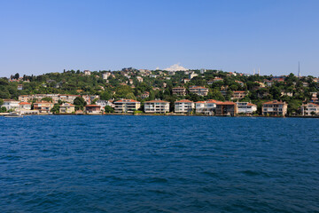 Turquoise blue sea water. View of the Bosphorus in Istanbul city on sunny summer day, in a public place.