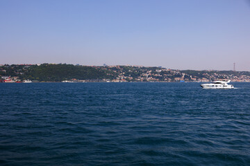 Turquoise blue sea water. View of the Bosphorus in Istanbul city on sunny summer day, in a public place.