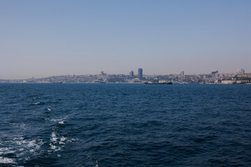 Turquoise blue sea water. View of the Bosphorus in Istanbul city on sunny summer day, in a public place.