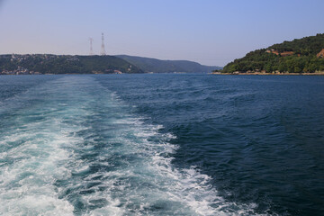 Turquoise blue sea water. View of the Bosphorus in Istanbul city on sunny summer day, in a public place.