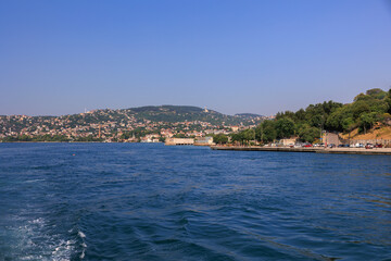 Fototapeta premium Turquoise blue sea water. View of the Bosphorus in Istanbul city on sunny summer day, in a public place.