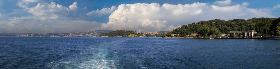 Fototapeta premium Turquoise blue sea water. View of the Bosphorus in Istanbul city on sunny summer day, in a public place.