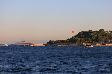 Obraz premium Evening sea view off the coast of Istanbul. Orange sunset sky 