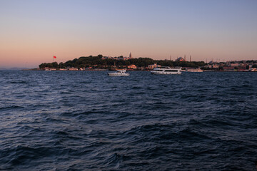Obraz premium Evening sea view off the coast of Istanbul. Orange sunset sky 