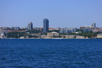 Naklejka premium Blue seascape overlooking the coast. View of the Bosphorus in Istanbul city on sunny summer day, in a public place.