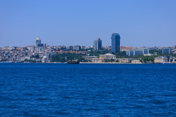 Fototapeta premium Blue seascape overlooking the coast. View of the Bosphorus in Istanbul city on sunny summer day, in a public place.