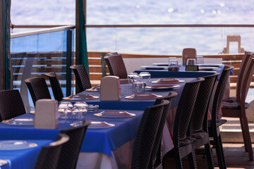 Beautiful views from above, tables in a cafe in the mountains and a panoramic view of the city, public places in Turkey, on a sunny summer day