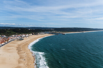 View from the hill to the sandy beach 'Praia da Nazaré' , Praia do Norte beach and Nazare town, Portugal