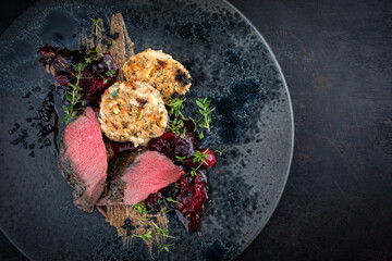 Traditionally roasted saddle of venison fillet with South Tyrolean bread dumplings, cherry jam and...