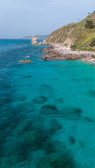 Fototapeta premium Aerial view of Michelino beach in Parghelia, Tropea. Calabria. Italy. Transparent sea and luxuriant nature. The most beautiful beach in Europe