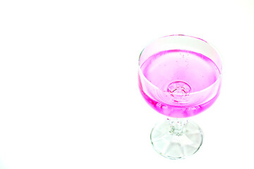 Pink lavender lemonade in glass on white background