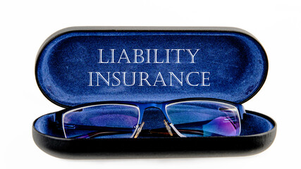 Text Liability Insurance on an open case with eyeglasses