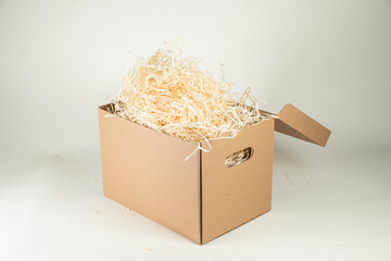 Cardboard box with wood filling on a white background