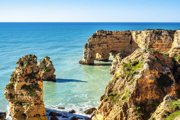 Praia da Marinha Beach among rock islets and cliffs seen from Seven Hanging Valleys Trail, Algarve,...