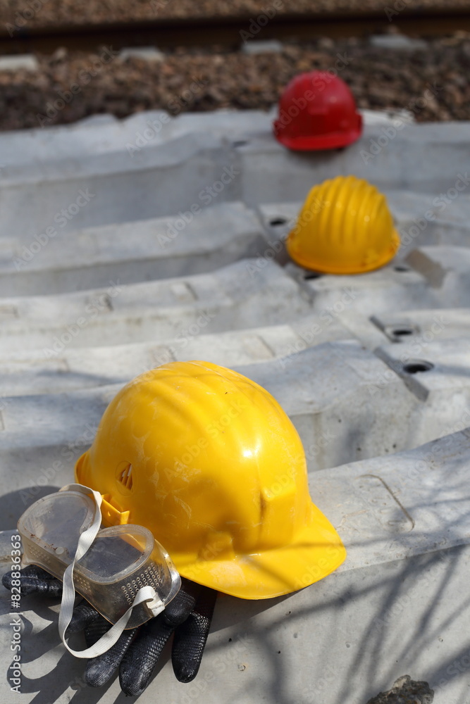 Wall mural yellow helmet on a work site