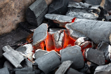 Details of charcoal for barbecue at picnic, burning coals