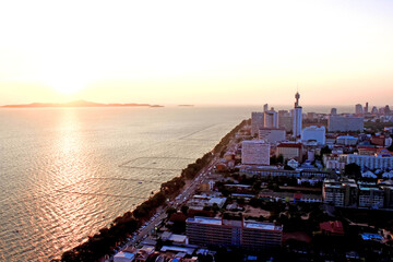 stunning sunset over a coastal cityscape with a vibrant skyline and waterfront views