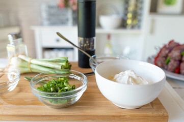 Ingredients for a homemade dipping sauce on a cutting board