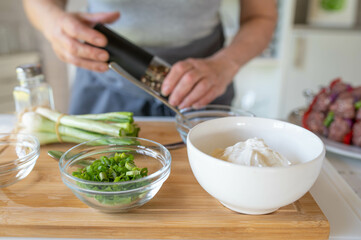 Ingredients for a homemade dipping sauce on a cutting board
