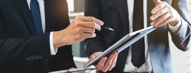 financial advisory services. Asian advisor showing plan of investment to clients in the consultancy office. - Powered by Adobe