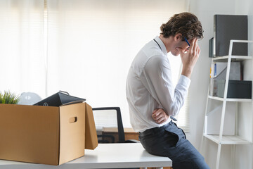 lay off workers. Sad fired Businessman feeling stress after losing his job in the office.
