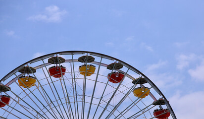 ferris wheel against a light blue sky