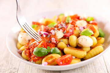 gnocchi with tomato, mozzarella cheese and basil