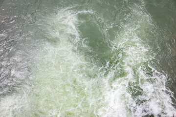 background with abstract water patterns - water flowing in the river