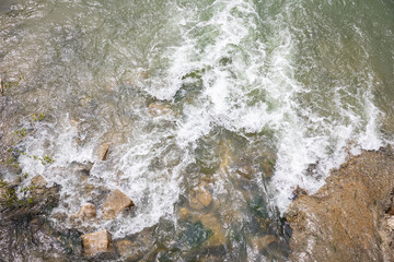 background with abstract water patterns - water flowing in the river